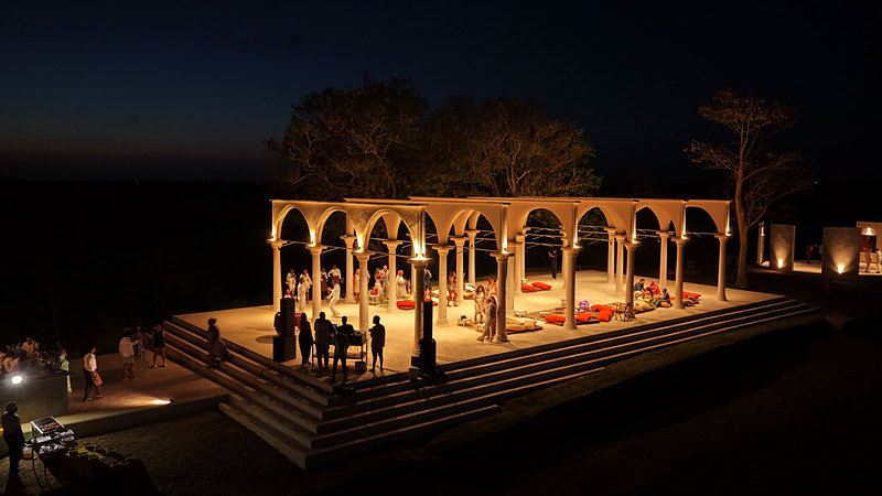 The illuminated temple at night during an event